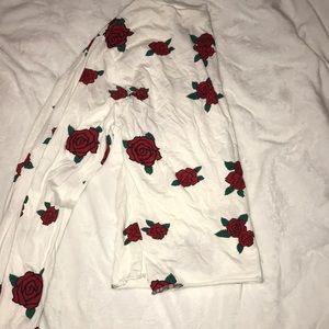 A white shirt with red roses